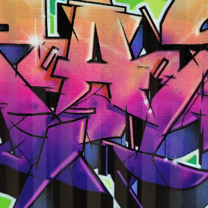 Close-up detail of Apashe's technical linework and mashup style throwie