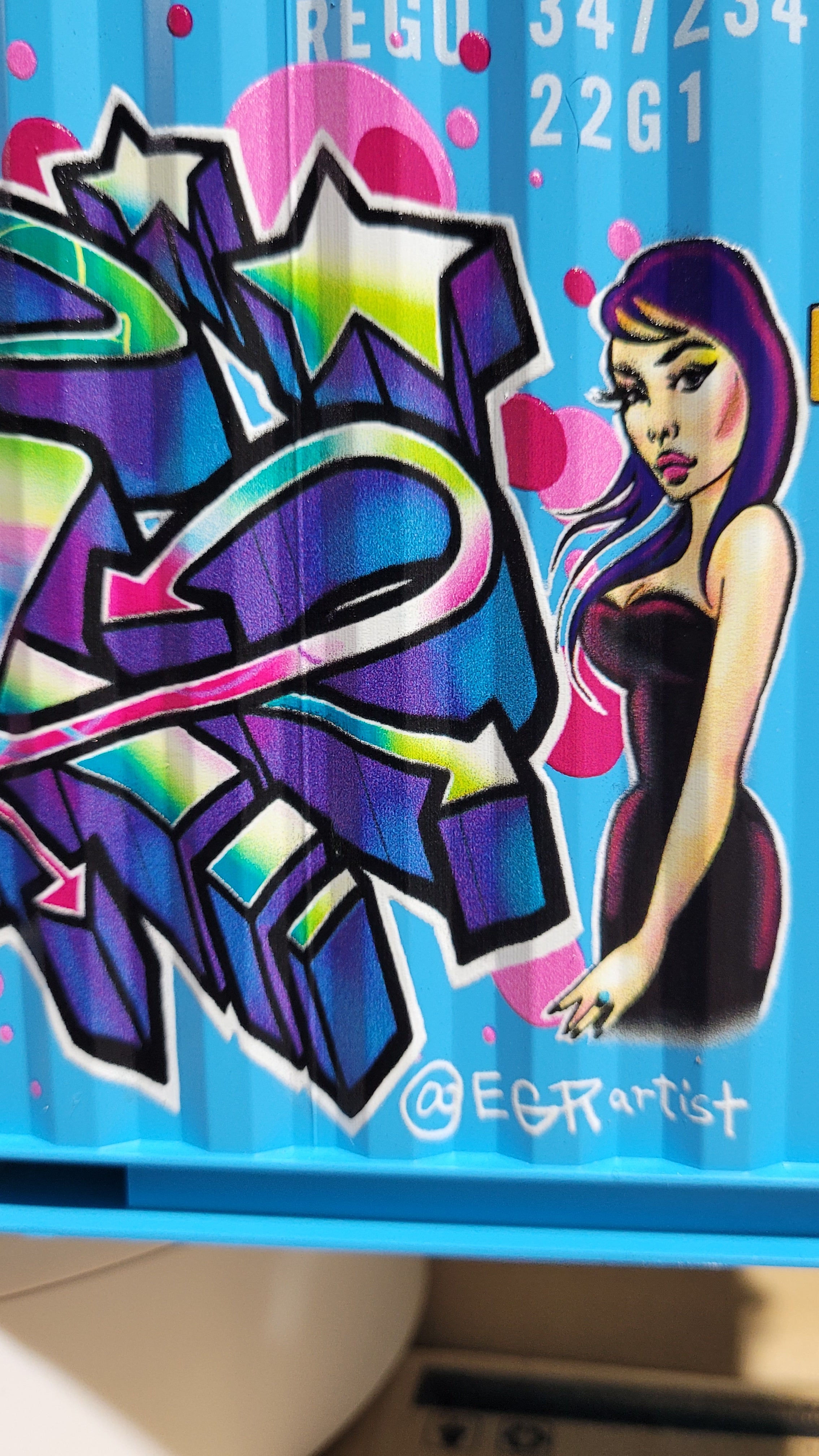Close-up detail of EGR's feminine characters and whimsical graffiti style